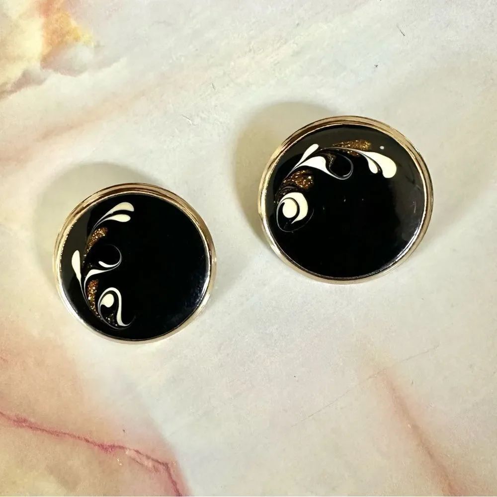 Black and gold tone round clip on earrings